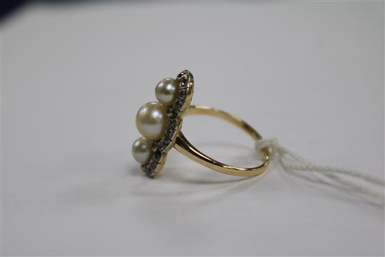 A yellow metal, cultured pearl and rose cut diamond triple cluster upfinger ring, size Q.